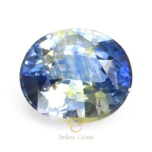 1.07 Ct Oval Bi Color Sapphire – Sri Lanka Natural 1.07 carat oval bi-color sapphire from Sri Lanka with soft blue and golden color zoning, mixed brilliant cut, eye-clean clarity, and no enhancement.